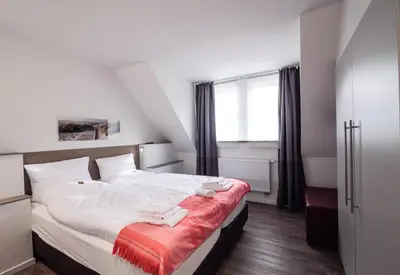 Ein Bett oder Betten in einem Zimmer der Unterkunft dat geele hus 1