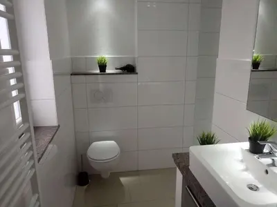 Ein Badezimmer in der Unterkunft dat geele hus Wohnung 6