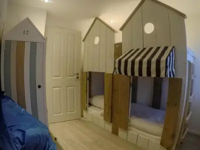 Ein Bett oder Betten in einem Zimmer der Unterkunft Beachhouse