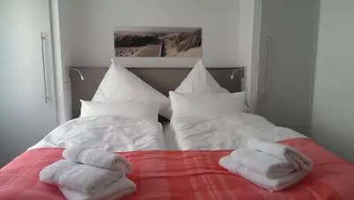 Ein Bett oder Betten in einem Zimmer der Unterkunft dat geele hus Wohnung Nr. 4