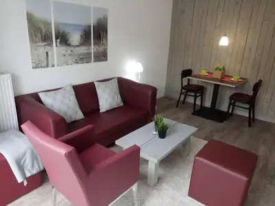 Ein Sitzbereich in der Unterkunft dat geele hus Wohnung Nr. 4