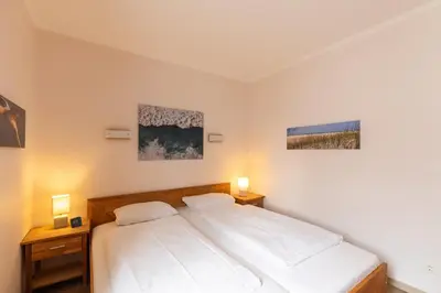 Ein Bett oder Betten in einem Zimmer der Unterkunft Fischerhus - Wohnung 2