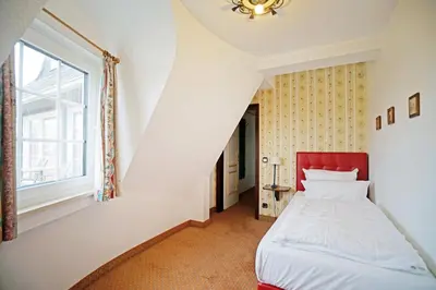 Ein Bett oder Betten in einem Zimmer der Unterkunft Hotel Appartement Landhaus Stutzi - Hotel Strandperle