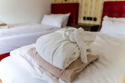 Ein Bett oder Betten in einem Zimmer der Unterkunft Hotel Appartement Landhaus Stutzi - Hotel Strandperle