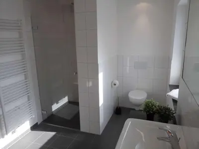 Ein Badezimmer in der Unterkunft dat witte hus 1