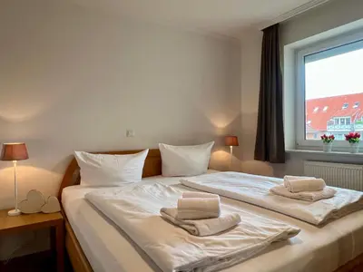 Ein Bett oder Betten in einem Zimmer der Unterkunft Stranddomicil Steiner