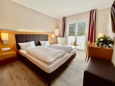 Ein Bett oder Betten in einem Zimmer der Unterkunft Moin Hotel Cuxhaven