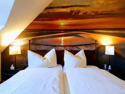 Ein Bett oder Betten in einem Zimmer der Unterkunft Ferienwohnungen Auf der Düne
