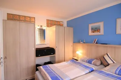 Ein Bett oder Betten in einem Zimmer der Unterkunft Vogelsand 324