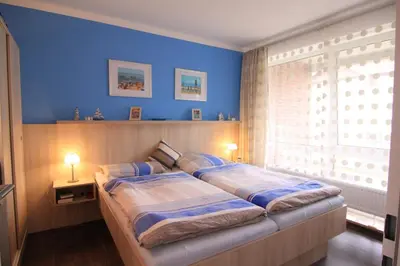 Ein Bett oder Betten in einem Zimmer der Unterkunft Vogelsand 324
