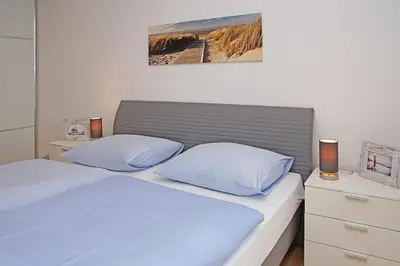 Ein Bett oder Betten in einem Zimmer der Unterkunft Haus Marina 28