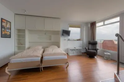 Ein Bett oder Betten in einem Zimmer der Unterkunft Christiansen im Panoramahaus Duhnen