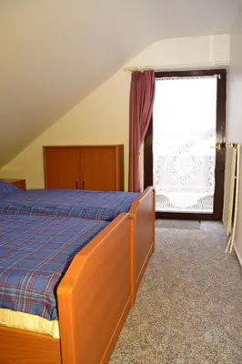 Ein Bett oder Betten in einem Zimmer der Unterkunft Ferienwohnung Hoyler