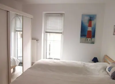 Ein Bett oder Betten in einem Zimmer der Unterkunft Robbenplate 19