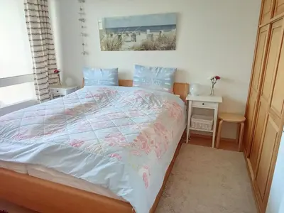 Ein Bett oder Betten in einem Zimmer der Unterkunft Vogelsand 343