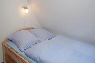 Ein Bett oder Betten in einem Zimmer der Unterkunft Muschelsucher