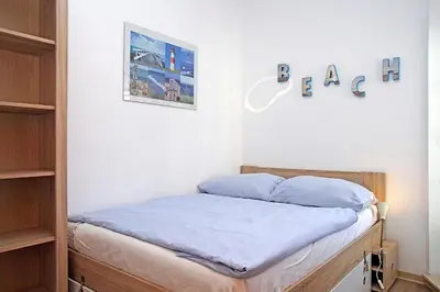 Ein Bett oder Betten in einem Zimmer der Unterkunft Fischerhus - Wohnung 3