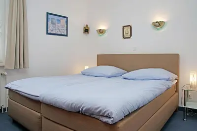 Ein Bett oder Betten in einem Zimmer der Unterkunft Fischerhus - Wohnung 5