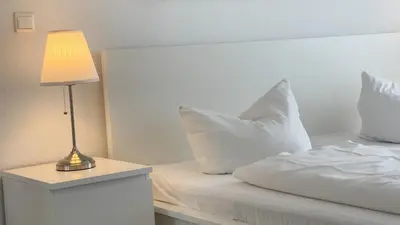 Ein Bett oder Betten in einem Zimmer der Unterkunft Ferienwohnung Nordseebrandung B4.1