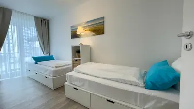 Ein Bett oder Betten in einem Zimmer der Unterkunft Ferienwohnung Nordseebrandung B3.1