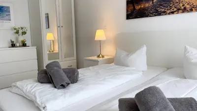 Ein Bett oder Betten in einem Zimmer der Unterkunft Ferienwohnung Nordseebrandung D1.1