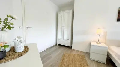 Ein Bett oder Betten in einem Zimmer der Unterkunft Ferienwohnung Nordseebrandung B1.3