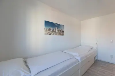 Ein Bett oder Betten in einem Zimmer der Unterkunft Quartier Hohe Geest - Wohnung Meerzeit