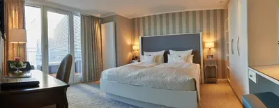 Ein Bett oder Betten in einem Zimmer der Unterkunft Badhotel Sternhagen
