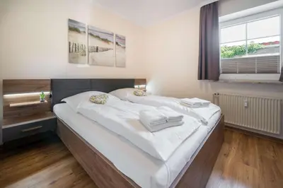 Ein Bett oder Betten in einem Zimmer der Unterkunft Warft-Idyll - An de Warft
