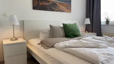 Ein Bett oder Betten in einem Zimmer der Unterkunft Ferienwohnung Nordseebrandung A1.4