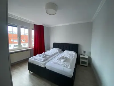 Ein Bett oder Betten in einem Zimmer der Unterkunft Haus Nordsee 06