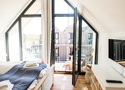 Ein Bett oder Betten in einem Zimmer der Unterkunft Beachhus