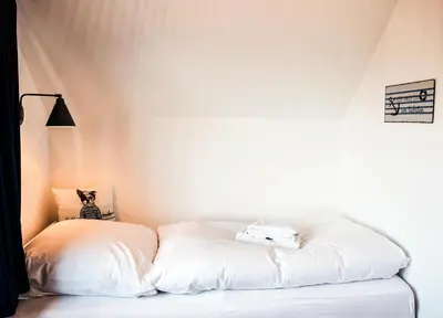 Ein Bett oder Betten in einem Zimmer der Unterkunft Beachhus