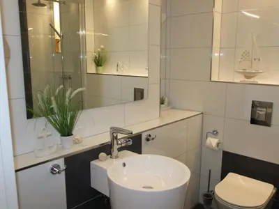 Ein Badezimmer in der Unterkunft Ferienwohnung mit Seeischt im Haus Frische Brise 05.10