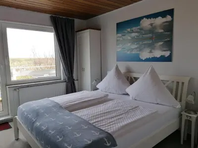Ein Bett oder Betten in einem Zimmer der Unterkunft Hotel Möven-Kieker