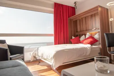 Ein Bett oder Betten in einem Zimmer der Unterkunft Strandnahe Ferienwohnung FB11.06 mit Meerblick