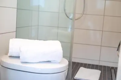 Ein Badezimmer in der Unterkunft Strandnahe Ferienwohnung FB11.06 mit Meerblick