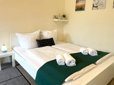 Ein Bett oder Betten in einem Zimmer der Unterkunft Ferienwohnung strandnah im Haus Frauenpreiss 56