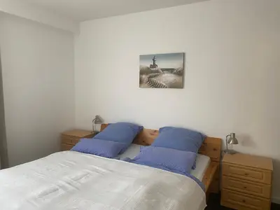Ein Bett oder Betten in einem Zimmer der Unterkunft Apartmenthaus am Watt Büsum