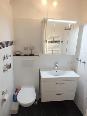 Ein Badezimmer in der Unterkunft Watten-Blick 2