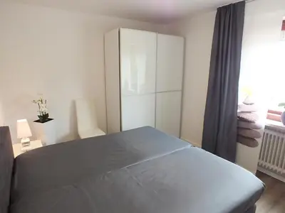 Ein Bett oder Betten in einem Zimmer der Unterkunft Watten-Blick 2