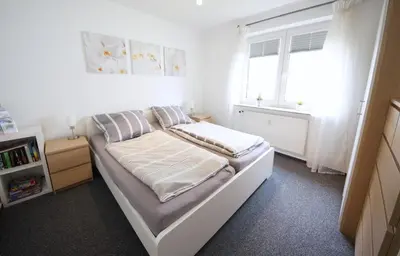 Ein Bett oder Betten in einem Zimmer der Unterkunft Appartementhaus Nige Ooge Ferienwohnung Nr. 3