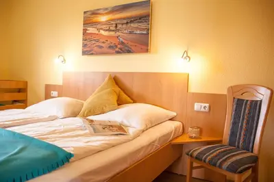 Ein Bett oder Betten in einem Zimmer der Unterkunft Ferienhaus Strandnixe