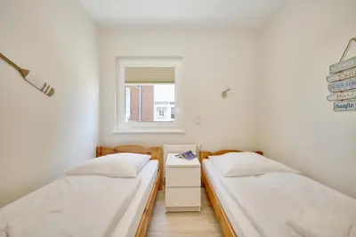Ein Bett oder Betten in einem Zimmer der Unterkunft Haus Pamir - Fewo 22
