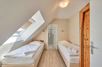 Ein Bett oder Betten in einem Zimmer der Unterkunft Haus Pamir - Fewo 26