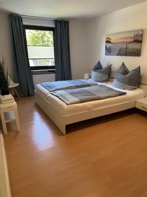 Ein Bett oder Betten in einem Zimmer der Unterkunft Gästehaus Bremer