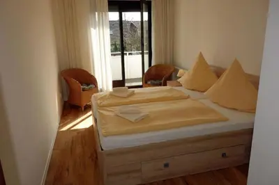 Ein Bett oder Betten in einem Zimmer der Unterkunft Herzmuschel