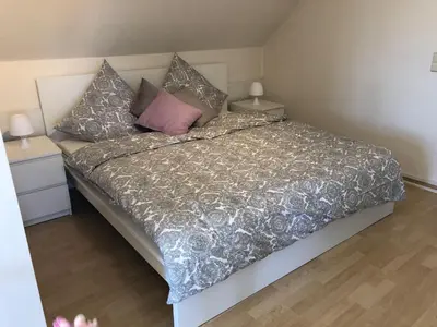 Ein Bett oder Betten in einem Zimmer der Unterkunft Ferienwohnung Op'n Rugenbarg 70