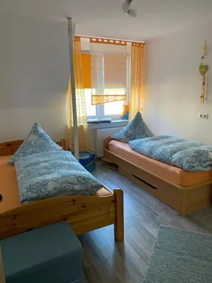Ein Bett oder Betten in einem Zimmer der Unterkunft Ferienwohnung Meer&mehr