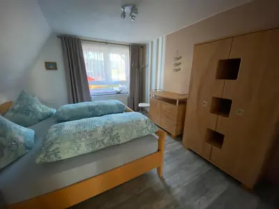 Ein Bett oder Betten in einem Zimmer der Unterkunft Ferienwohnung Meer&mehr